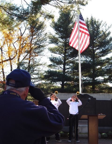 Veteran saluting the American flag